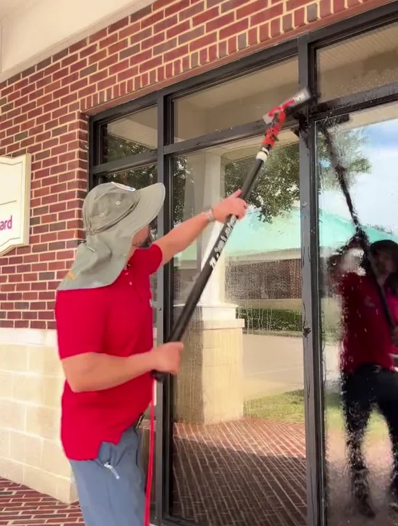 Our team cleaning storefront glass