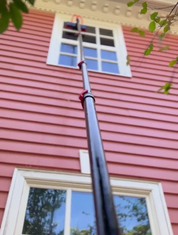 Brush cleaning upper windows with purified deionized water.